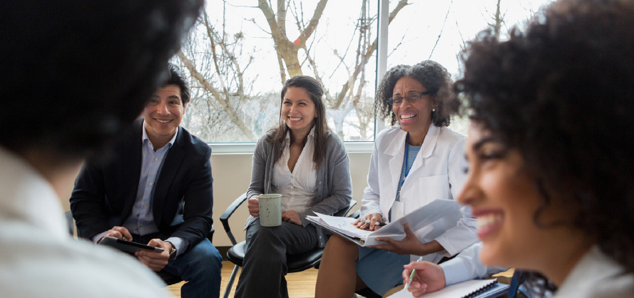 image of people talking to a doctor