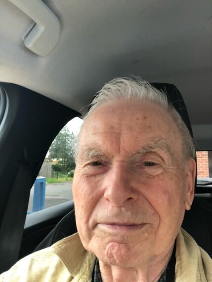 GBS patient taking a photo of himself in the car
