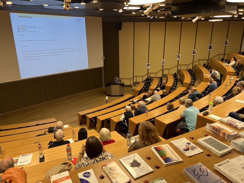 individuals sitting in a conference space