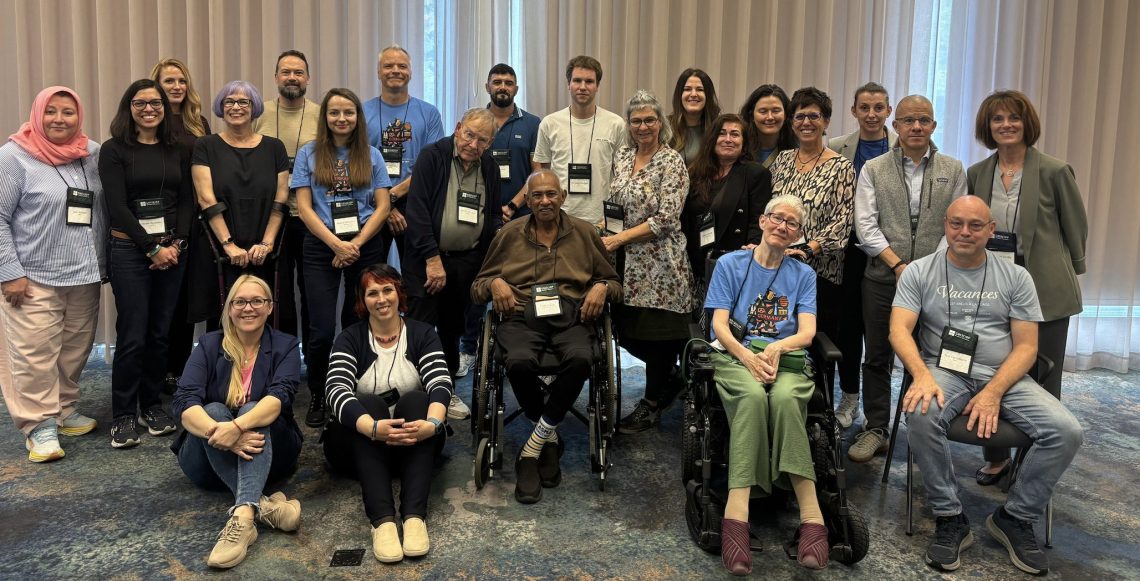 group of people standing together for a photo at a conference